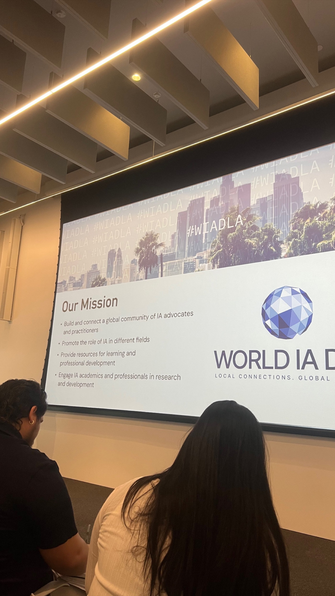 A presentation slide at World IA Day comparing taxonomy levels and tags