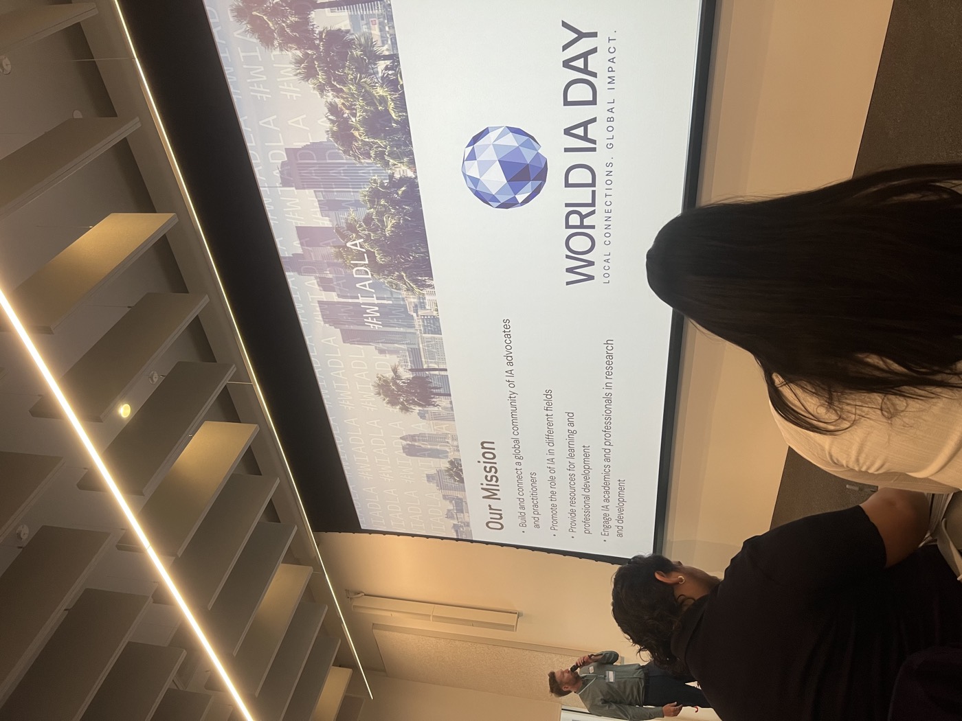 A presentation slide at World IA Day comparing taxonomy levels and tags